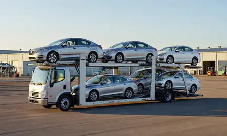 Car transporter loaded with vehicles in Evanston, Wyoming, United States