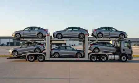 Car transporter parked in an industrial area of Evansville, Wyoming, United States