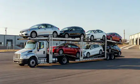 Car transporter loaded with vehicles in Evansville, Wyoming, United States