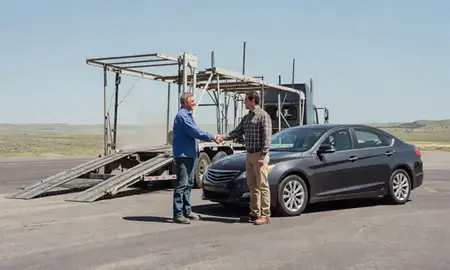 Vehicle owner beside their delivered car in Gillette, Wyoming, United States