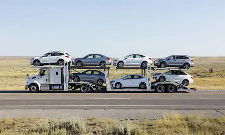 Multi-level car carrier on the highway to Glenrock, Wyoming, United States