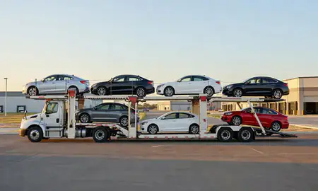 Car transporter parked in an industrial area of Glenrock, Wyoming, United States