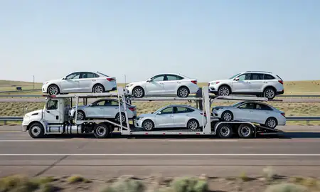 Multi-level car carrier on the highway to Kemmerer, Wyoming, United States