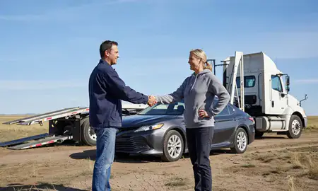 Vehicle owner beside their delivered car in Laramie, Wyoming, United States