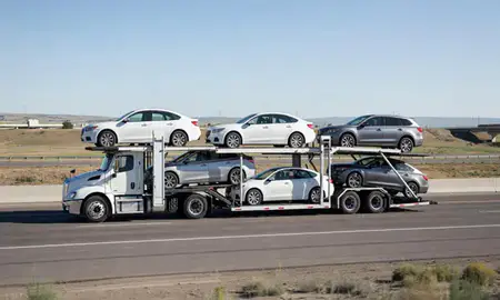 Multi-level car carrier on the highway to Mills, Wyoming, United States