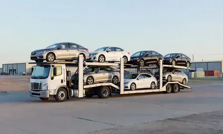 Car transporter loaded with vehicles in Ranchettes, Wyoming, United States