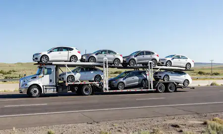 Multi-level car carrier on the highway to Rock Springs, Wyoming, United States