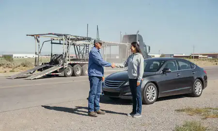 Vehicle owner beside their delivered car in Rock Springs, Wyoming, United States