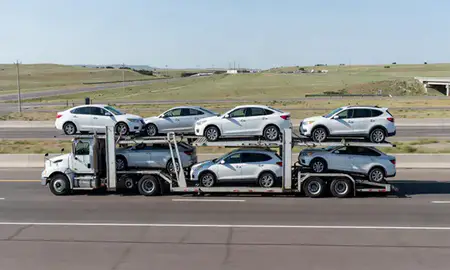 Multi-level car carrier on the highway to South Greeley, Wyoming, United States