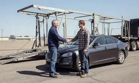 Vehicle owner beside their delivered car in South Greeley, Wyoming, United States
