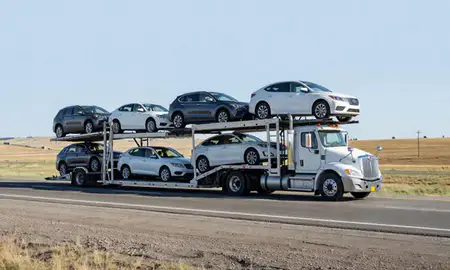 Multi-level car carrier on the highway to Torrington, Wyoming, United States