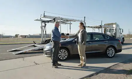 Vehicle owner beside their delivered car in Torrington, Wyoming, United States
