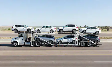 Multi-level car carrier on the highway to Warren AFB, Wyoming, United States