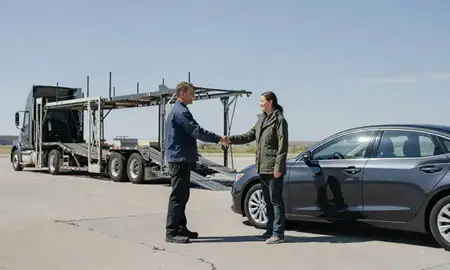 Vehicle owner beside their delivered car in Warren AFB, Wyoming, United States