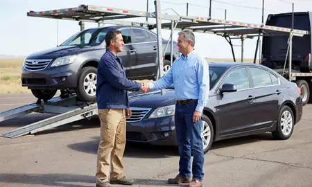 Vehicle owner beside their delivered car in Wheatland, Wyoming, United States